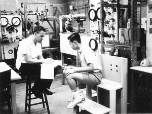 Warren Stewart (left) and Liong S. Tee (PhD '68) work in the lab Nov., 1966